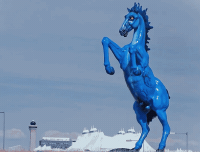Blue Horse With Red Eye Next To Black Horse GIF