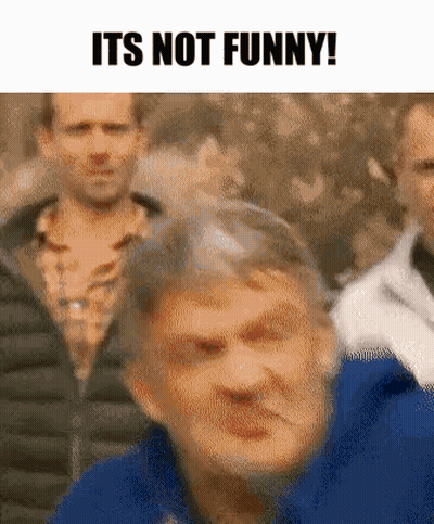 Blue Jacket Man Making Funny Face At Group GIF