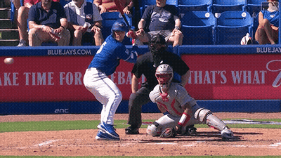 Blue Jays Baseball Player Swinging At Ball GIF