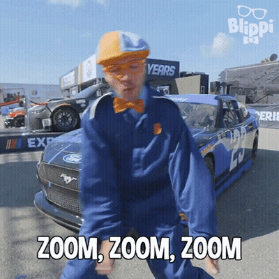 Blue Jumpsuit Man Dancing By Race Car Zoom Zoom Zoom GIF