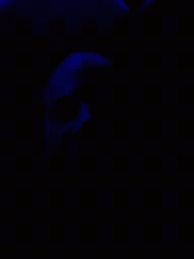 Blue Light Shining On Dark Blue Background GIF