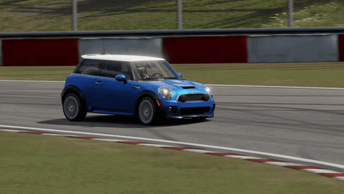 Blue Mini Cooper Driving Down Race Track GIF