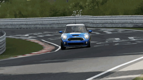 Blue Mini Cooper Driving Down Race Track GIF
