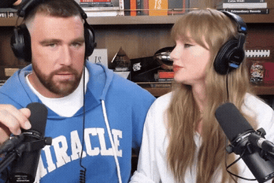 Blue Miracle Sweatshirt Man Talking To Headphone Woman GIF