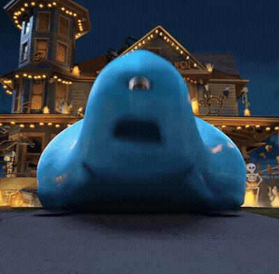 Blue Monster In Front Of Haunted House Saying Happy Halloween GIF