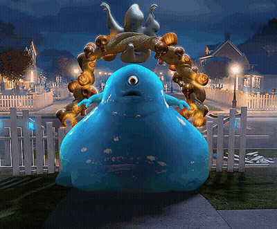 Blue Monster Standing In Front Of Fence With Pumpkins GIF