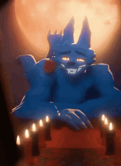 Blue Monster With Rose In Mouth Sitting In Front Of Candles GIF