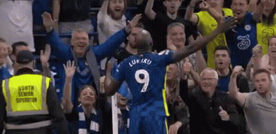 Blue Number 9 Soccer Player Celebrating With Fans GIF
