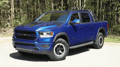 Blue Ram Truck Parked On Dirt Road GIF