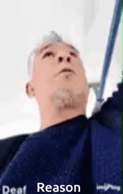 Blue Shirt Man Holding Mop Looking Up GIF