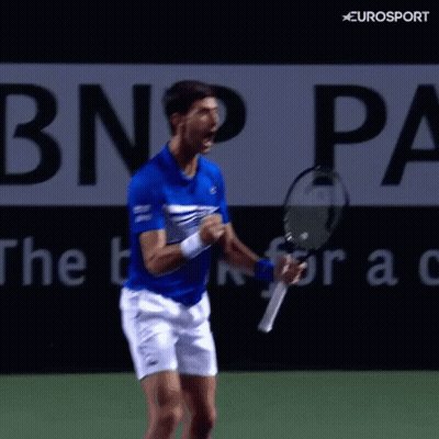 Blue Shirt Man Holding Tennis Racquet With Eurosport Logo GIF