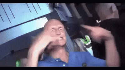 Blue Shirt Man Making Funny Face, Man Points GIF
