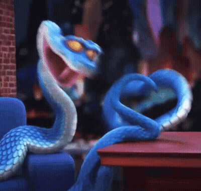 Blue Snake Sitting On Couch Mouth Open GIF