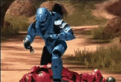 Blue Soldier Standing Over Red Soldier Lying On Ground GIF