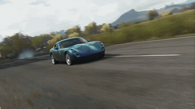 Blue Sports Car Driving Down Road GIF