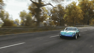 Blue Sports Car Driving Down Road GIF