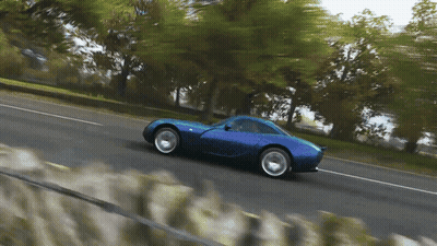 Blue Sports Car Driving Down Road GIF