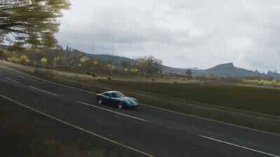 Blue Sports Car Driving Down Road GIF