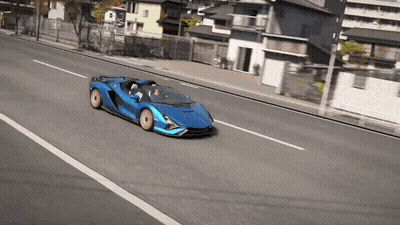 Blue Sports Car Driving Down Road GIF