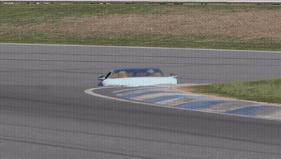 Blue Sports Car Driving Down Track GIF