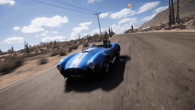 Blue Sports Car Driving In Desert GIF