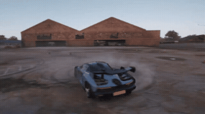 Blue Sports Car Driving On Dirt Road GIF