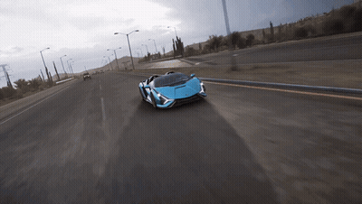 Blue Sports Car On Desert Highway GIF