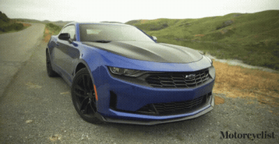 Blue Sports Car Parked On Road With Motorcyclist GIF