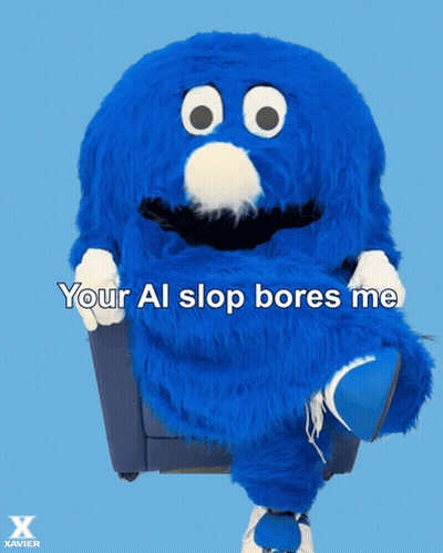 Blue Stuffed Animal In Chair Saying Your Al Slop Bores Me GIF
