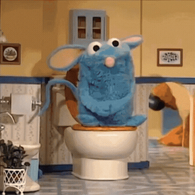 Blue Stuffed Animal Sitting On Toilet GIF