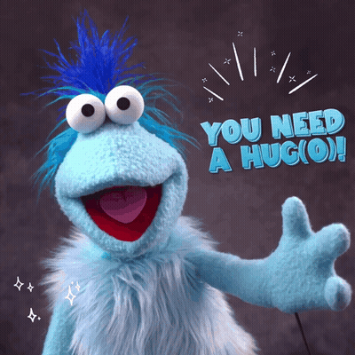 Blue Stuffed Animal With Blue Mohawk Saying You Need A Hug (O) GIF