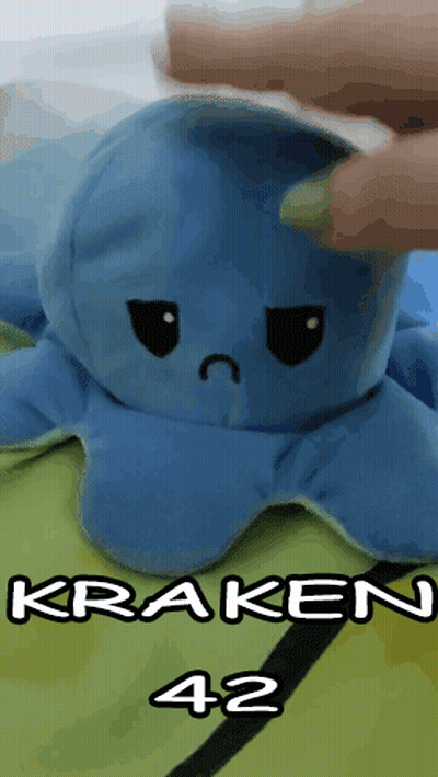 Blue Stuffed Octopus With Sad Face Being Held GIF