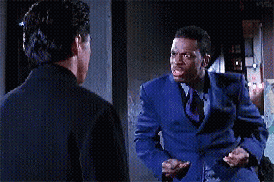 Blue Suit Man With Tie Talking To Black Suit Man GIF