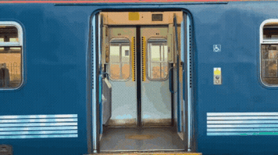 Blue Train With Open Doors And Handicapped Sign GIF