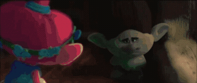 Blue Troll With Purple Hat Holding Red Object GIF