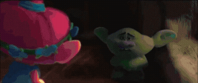 Blue Troll With Purple Hat Standing In Grass GIF