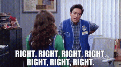 Blue Vest Man Talking To Green Shirt Woman GIF
