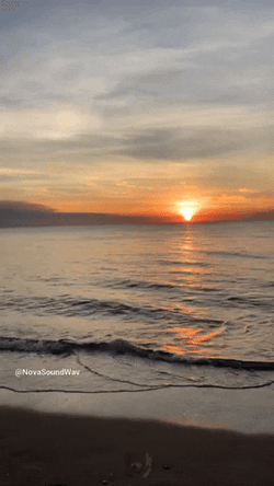 Blue Wave Flowing On Sunrise GIF