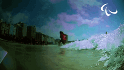 Blue Wave Splashes On The Camera GIF