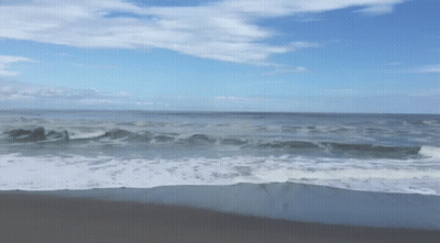Blurred Beach With Crashing Waves GIF