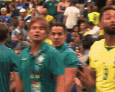 Blurred Crowd With Man In Yellow Shirt Number 8 GIF