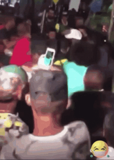 Blurred Crowd With Smiley Face GIF
