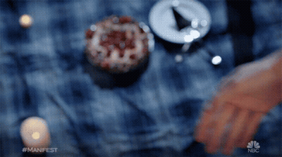Blurred Hand With NBC Logo GIF