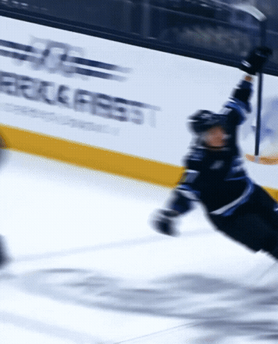 Blurred Hockey Player On Ice With Eagle Fest Banner GIF