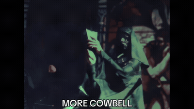 Blurred Man Holding Paper Saying More Cowbell GIF