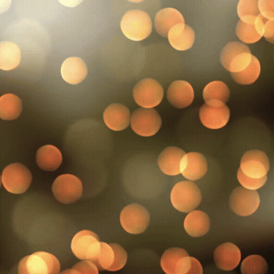 Blurred Orange Circles On Dark Brown GIF