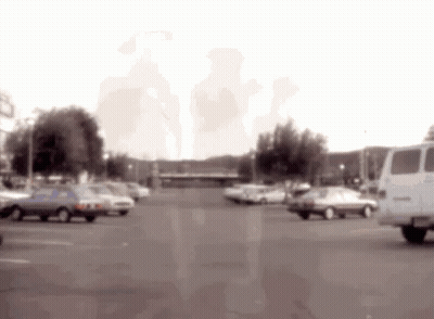 Blurred Parking Lot With Cars And Van GIF