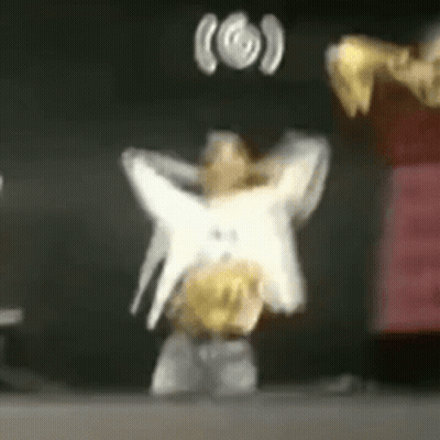 Blurred Person Dancing With Star On Back GIF