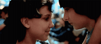 Blurred Person Holding Stuffed Animal With Pointing Hand GIF