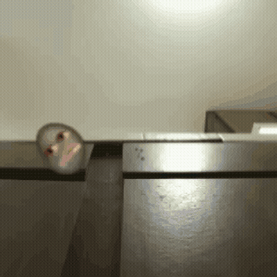 Blurred Person Peeking From Behind Door GIF